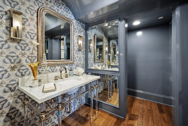 24 Farnham Park Dr, Houston, TX 77024 - bathroom featuring a sink, wallpapered walls, and wood finished floors