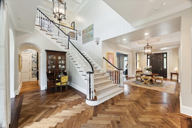 24 Farnham Park Dr, Houston, TX 77024 - entryway featuring baseboards, stairway, arched walkways, a chandelier, and ornamental molding
