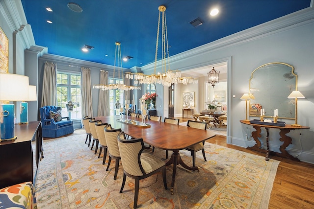 24 Farnham Park Dr, Houston, TX 77024 - dining space featuring ornamental molding, a chandelier, wood finished floors, and baseboards