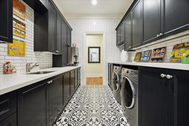 24 Farnham Park Dr, Houston, TX 77024 - laundry room featuring cabinet space, independent washer and dryer, and ornamental molding