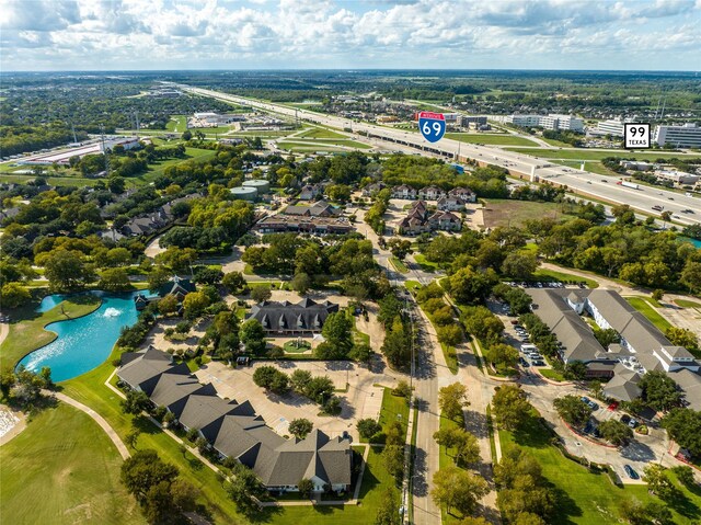 7215 Timberlake Dr, Sugar Land, TX 77479 - aerial perspective of suburban area featuring a large body of water and a tree filled landscape