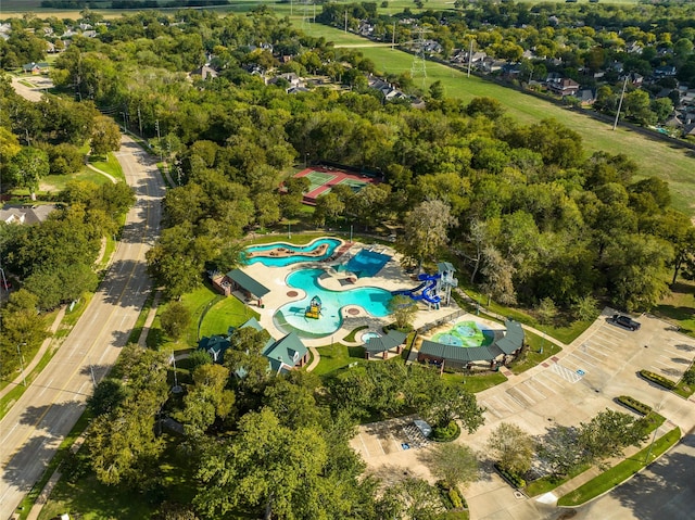 7215 Timberlake Dr, Sugar Land, TX 77479 - drone / aerial view of a pool and a tree filled landscape