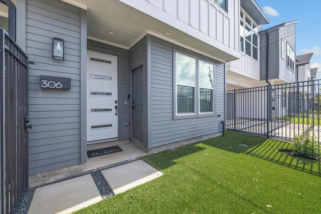 306 W Donovan St, Houston, TX 77091 - doorway to property featuring board and batten siding