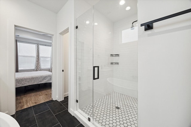306 W Donovan St, Houston, TX 77091 - bathroom featuring a shower stall, tile patterned floors, ensuite bathroom, and recessed lighting