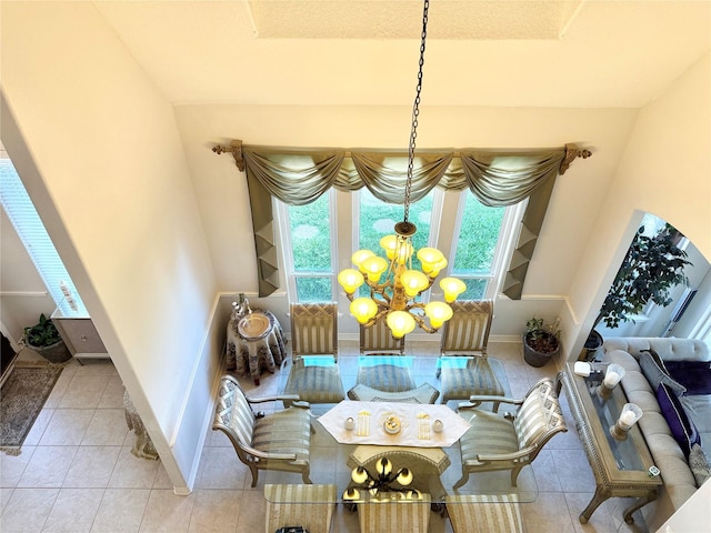2914 Renoir, Sugar Land, TX 77479 - tiled dining space featuring a chandelier and baseboards