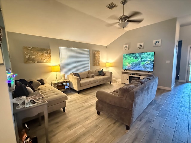 207 Leisure Ln, Montgomery, TX 77356 - living room featuring wood finished floors, vaulted ceiling, a ceiling fan, and baseboards