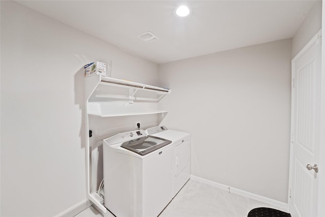 1318 Bellingham Park Dr, Missouri City, TX 77459 - washroom featuring washer and dryer, baseboards, recessed lighting, and light tile patterned flooring