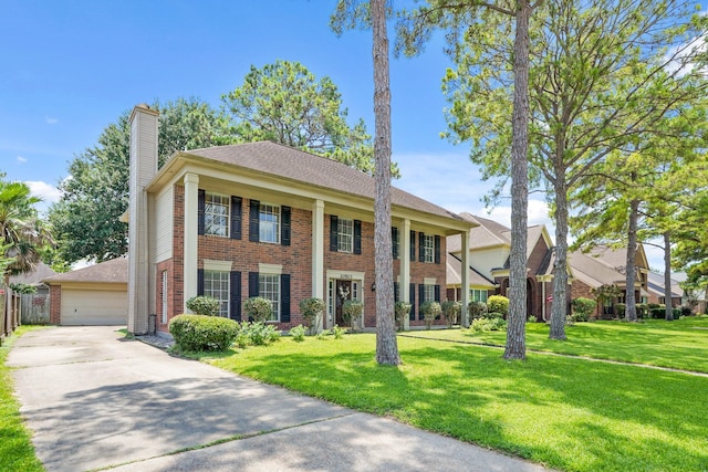 10503 Minturn Ln, Houston, TX 77064 - greek revival inspired property featuring brick siding, a chimney, a front yard, and a detached garage