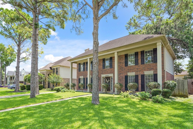 10503 Minturn Ln, Houston, TX 77064 - neoclassical / greek revival house featuring brick siding and a chimney