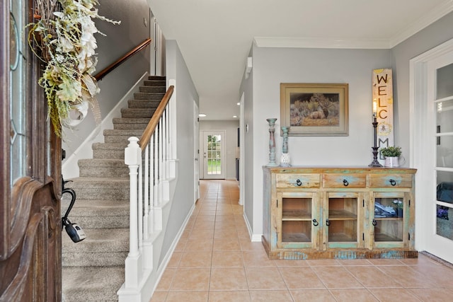 10503 Minturn Ln, Houston, TX 77064 - entryway featuring light tile patterned floors, stairway, and ornamental molding