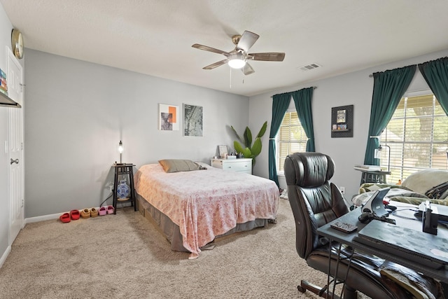 10503 Minturn Ln, Houston, TX 77064 - bedroom featuring light colored carpet, multiple windows, and ceiling fan