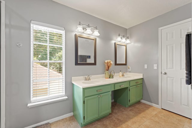 10503 Minturn Ln, Houston, TX 77064 - bathroom featuring double vanity, baseboards, and tile patterned flooring
