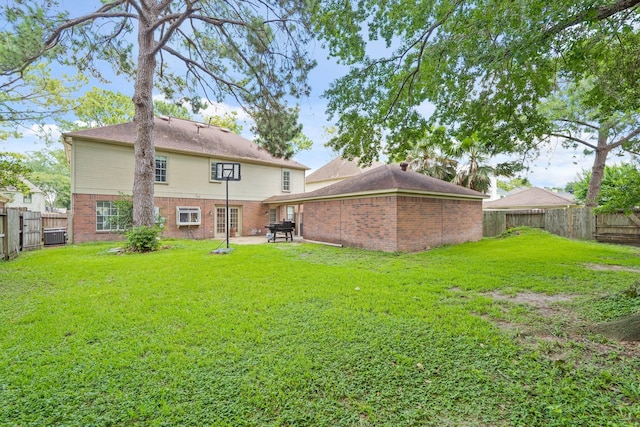 10503 Minturn Ln, Houston, TX 77064 - back of property featuring brick siding, a patio area, and central air condition unit