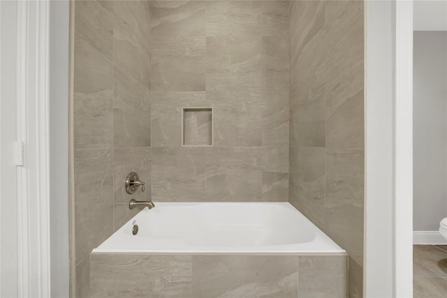 2609 Riverside Dr Unit C, Houston, TX 77004 - bathroom with toilet and tiled shower / bath combo