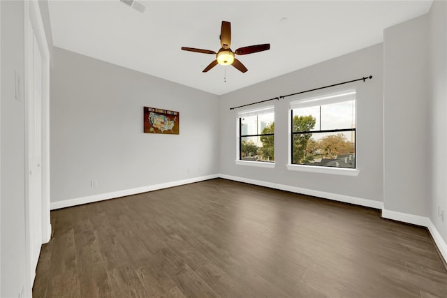 2609 Riverside Dr Unit C, Houston, TX 77004 - empty room with dark wood-style floors, a ceiling fan, and baseboards