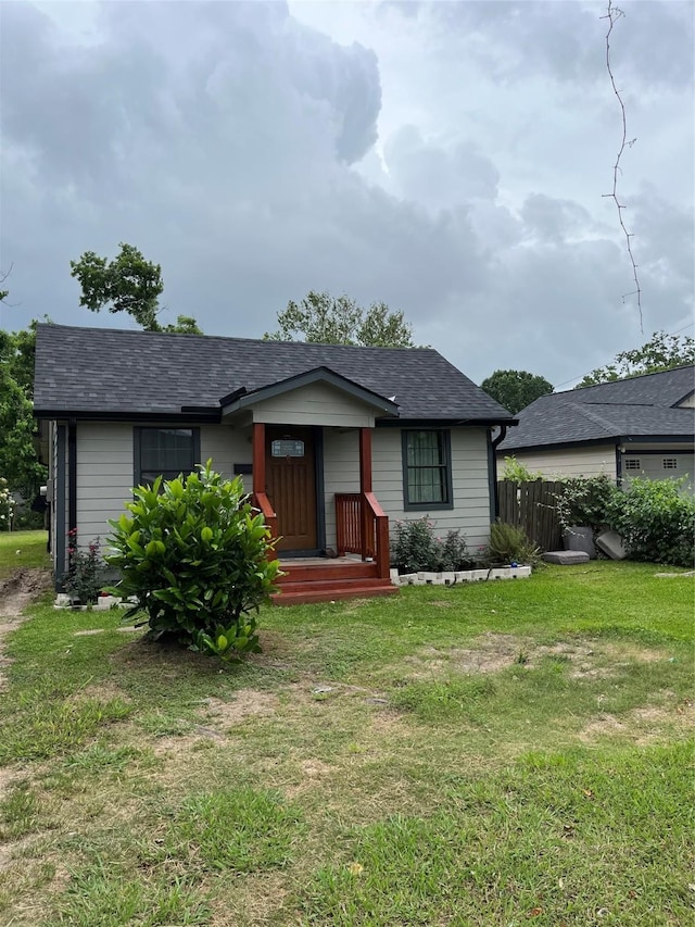 309 Aycock St, Clute, TX 77531 - view of front of house with a shingled roof