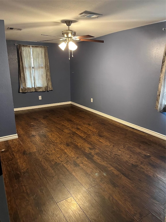 309 Aycock St, Clute, TX 77531 - unfurnished room featuring dark wood finished floors, a ceiling fan, and baseboards