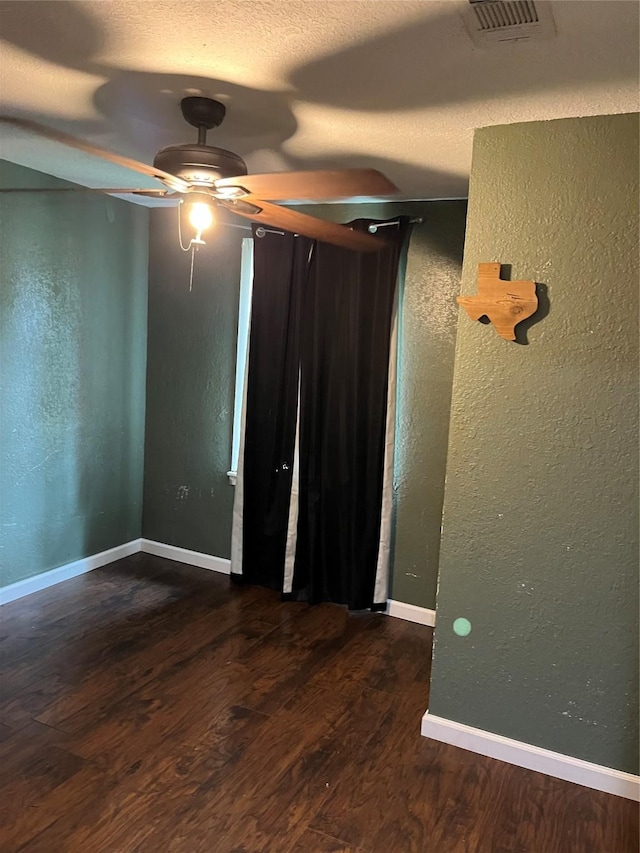 309 Aycock St, Clute, TX 77531 - unfurnished bedroom featuring a textured wall, wood finished floors, and baseboards