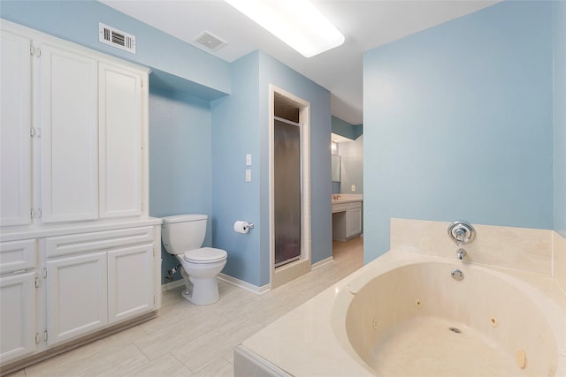 1402 Osborne Dr, Friendswood, TX 77546 - bathroom with toilet, a whirlpool tub, a shower stall, and vanity