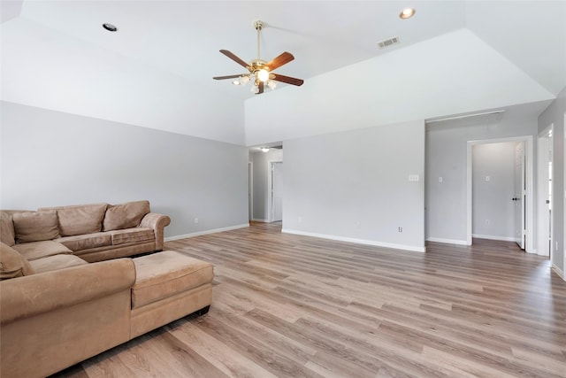1402 Osborne Dr, Friendswood, TX 77546 - living area featuring ceiling fan, light wood-type flooring, baseboards, attic access, and high vaulted ceiling