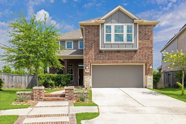 19426 Blueberry Cedar Dr, Cypress, TX 77433 - view of front facade featuring an attached garage, concrete driveway, board and batten siding, and brick siding