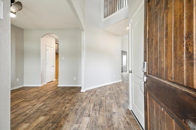 19426 Blueberry Cedar Dr, Cypress, TX 77433 - entryway featuring arched walkways, dark wood-style flooring, and baseboards