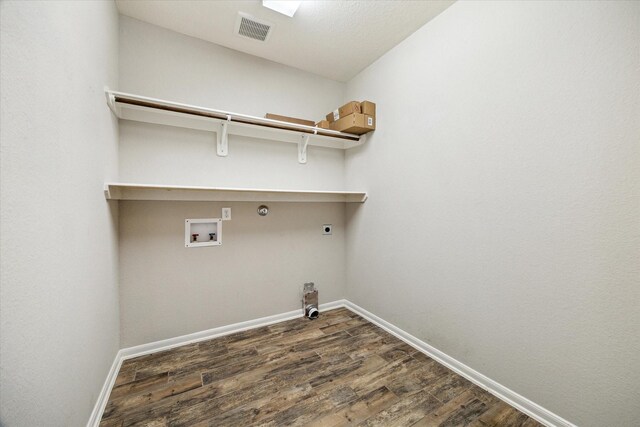 19426 Blueberry Cedar Dr, Cypress, TX 77433 - laundry area with baseboards, hookup for an electric dryer, hookup for a washing machine, dark wood finished floors, and hookup for a gas dryer