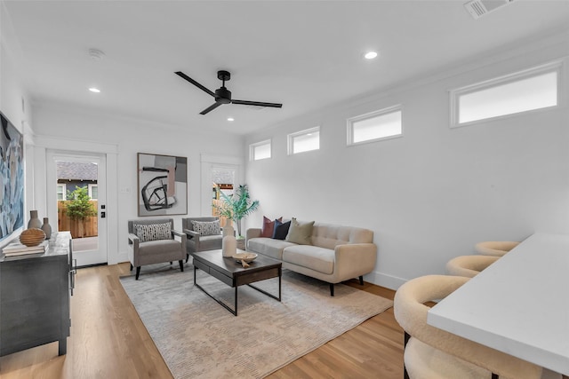 904 Willard St, Houston, TX 77006 - living room featuring healthy amount of natural light, ceiling fan, light wood-style floors, and recessed lighting