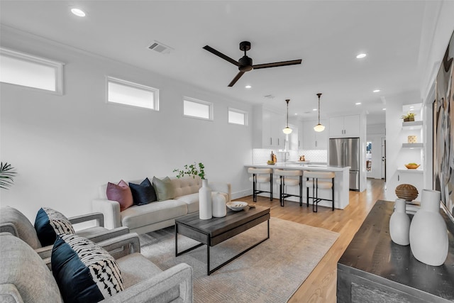 904 Willard St, Houston, TX 77006 - living room featuring ceiling fan, recessed lighting, and light wood-type flooring