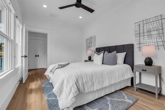 904 Willard St, Houston, TX 77006 - bedroom featuring wood finished floors, crown molding, baseboards, ceiling fan, and recessed lighting