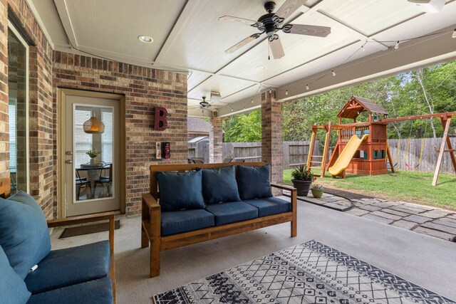 2678 Granite River Ln, Conroe, TX 77385 - fenced backyard with ceiling fan, a playground, an outdoor hangout area, and a patio area