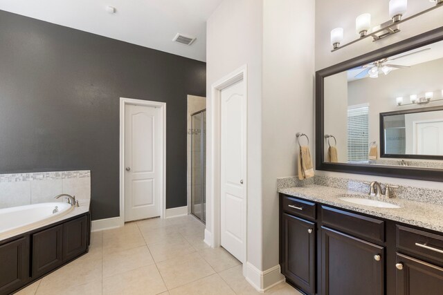 2678 Granite River Ln, Conroe, TX 77385 - full bath with ceiling fan, vanity, a stall shower, and tile patterned floors