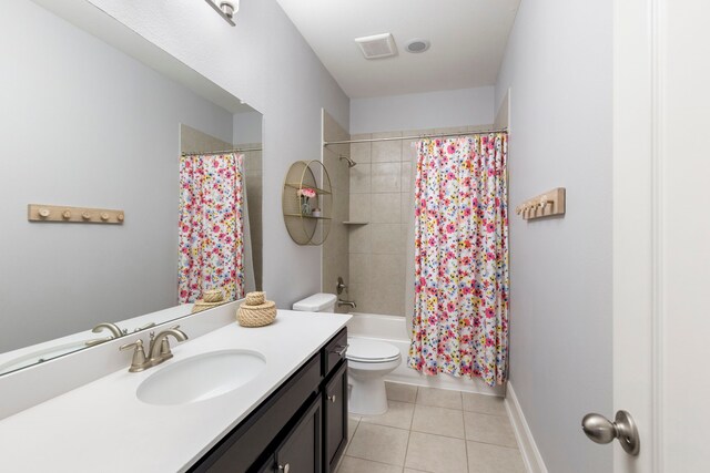 2678 Granite River Ln, Conroe, TX 77385 - bathroom featuring vanity, toilet, tile patterned flooring, and shower / bath combo with shower curtain