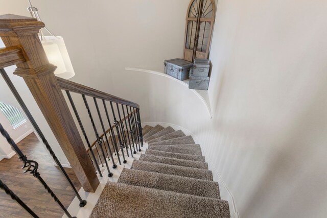 2678 Granite River Ln, Conroe, TX 77385 - stairs featuring wood finished floors and baseboards
