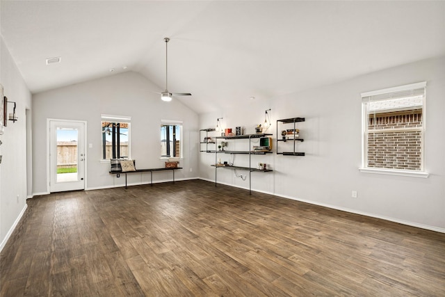 20382 Green Mountain Dr, New Caney, TX 77357 - unfurnished living room featuring ceiling fan, vaulted ceiling, wood finished floors, and baseboards