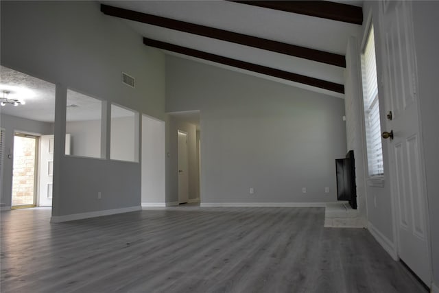 10011 Sageorchard Ln, Houston, TX 77089 - unfurnished living room with beam ceiling, high vaulted ceiling, light wood-type flooring, and baseboards