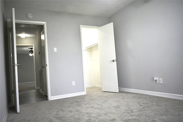 10011 Sageorchard Ln, Houston, TX 77089 - unfurnished bedroom with attic access, carpet flooring, baseboards, and a textured ceiling