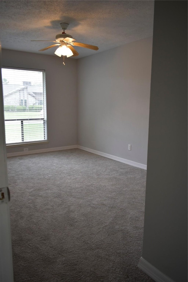 10011 Sageorchard Ln, Houston, TX 77089 - unfurnished room featuring a textured ceiling, a ceiling fan, baseboards, and carpet flooring