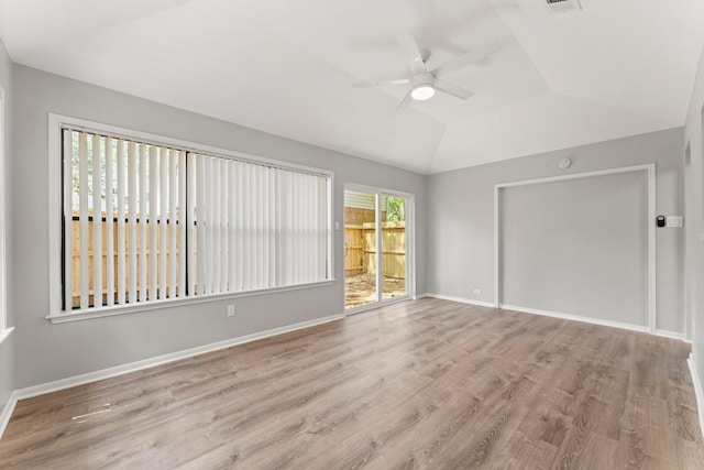235 E Rainbow Ridge Cir, The Woodlands, TX 77381 - spare room featuring ceiling fan, wood finished floors, and lofted ceiling