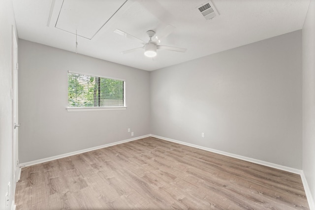 235 E Rainbow Ridge Cir, The Woodlands, TX 77381 - empty room with attic access, light wood-style flooring, and ceiling fan