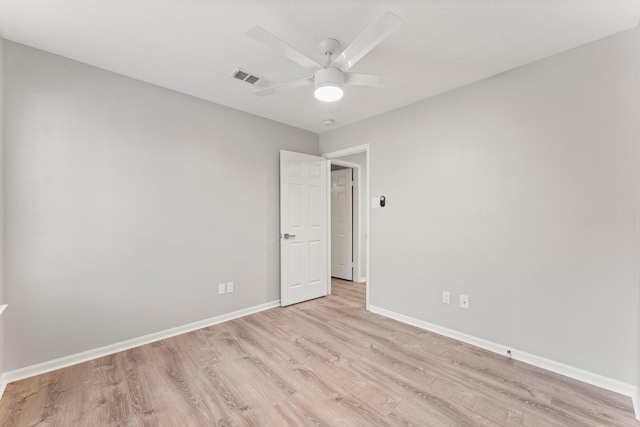 235 E Rainbow Ridge Cir, The Woodlands, TX 77381 - spare room featuring light wood-style flooring and a ceiling fan