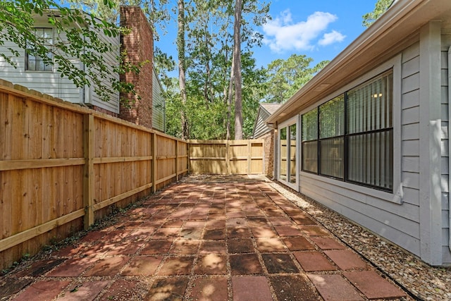 235 E Rainbow Ridge Cir, The Woodlands, TX 77381 - fenced backyard featuring a patio area