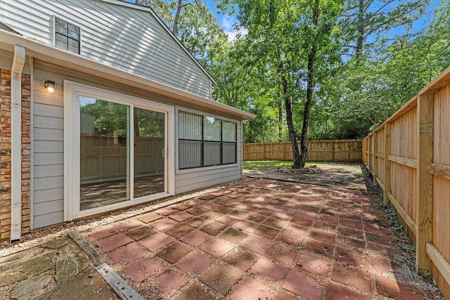 235 E Rainbow Ridge Cir, The Woodlands, TX 77381 - fenced backyard with a patio area