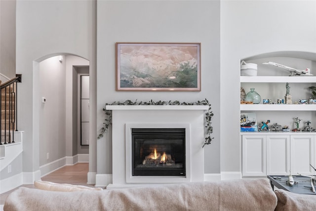 271 Bronze View Dr, Montgomery, TX 77316 - living area featuring arched walkways and a glass covered fireplace
