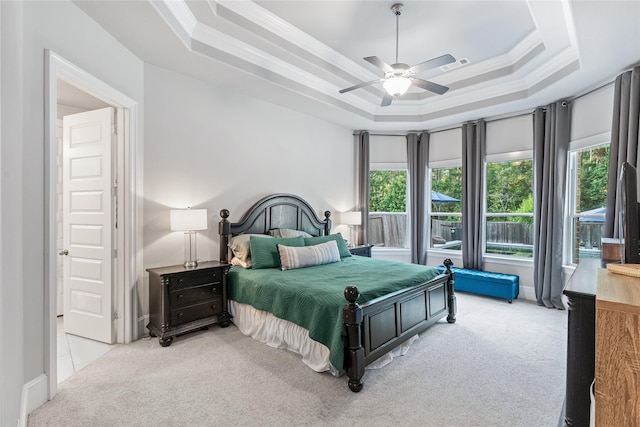 271 Bronze View Dr, Montgomery, TX 77316 - bedroom featuring carpet, multiple windows, crown molding, a tray ceiling, and ceiling fan