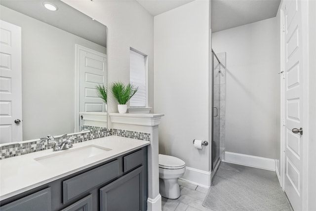 271 Bronze View Dr, Montgomery, TX 77316 - bathroom with a shower stall, toilet, vanity, baseboards, and tile patterned floors