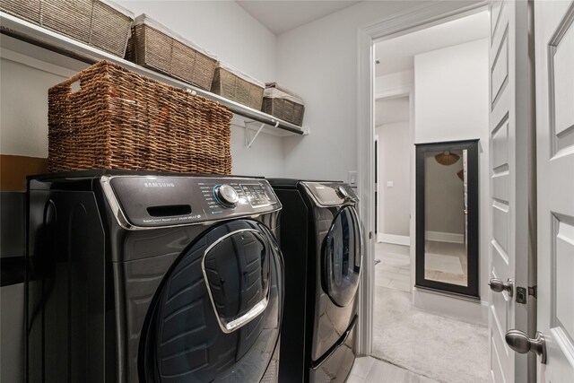 271 Bronze View Dr, Montgomery, TX 77316 - washroom featuring washing machine and clothes dryer and light tile patterned floors