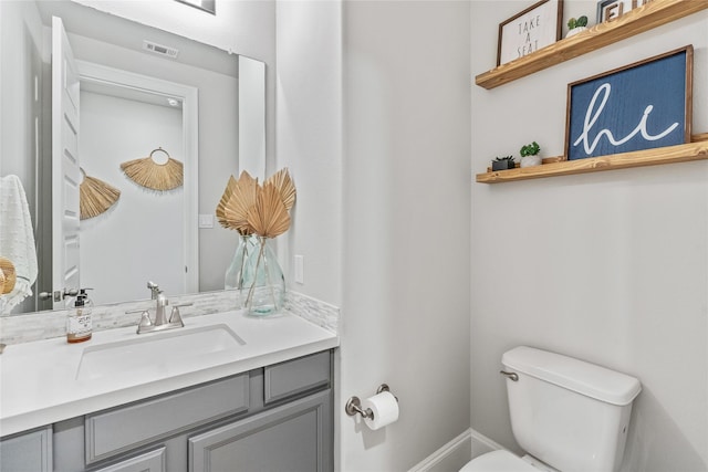 271 Bronze View Dr, Montgomery, TX 77316 - bathroom featuring toilet, vanity, and baseboards
