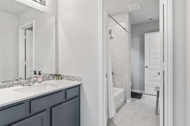 271 Bronze View Dr, Montgomery, TX 77316 - bathroom featuring vanity, bathtub / shower combination, tile patterned floors, and baseboards