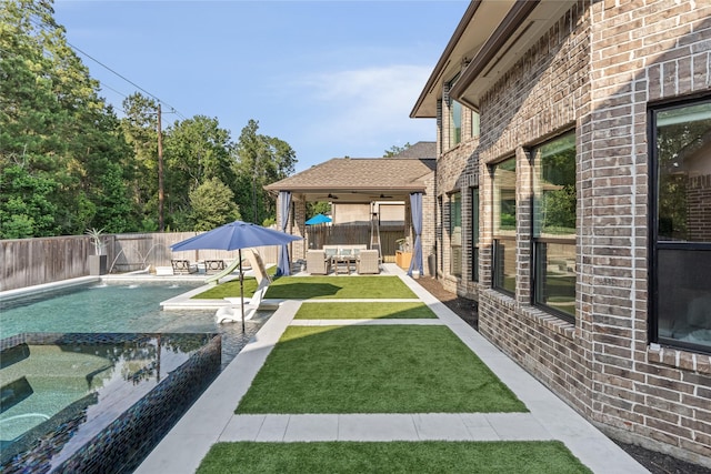 271 Bronze View Dr, Montgomery, TX 77316 - view of yard featuring a patio area, a pool with connected hot tub, and ceiling fan